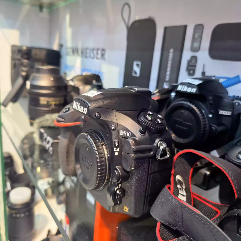 Certified used Nikon D810 and D3200 DSLR bodies on display at the CamCity showroom, representing the most trusted used cameras Dubai inventory.