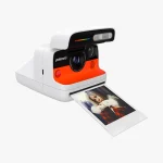 Polaroid Flip white instant camera front-on view iconic red shutter button LED display panel
